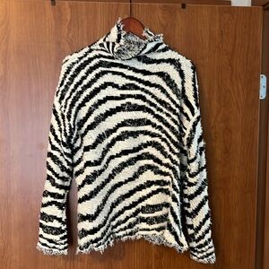 Tart “distressed” turtleneck